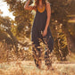 Minimalistisk jumpsuit med lommer og V-hals