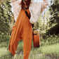 Minimalistisk jumpsuit med lommer og V-hals