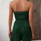 Kvinne jumpsuit med falske knapper og volangkant, rynket og vid ben