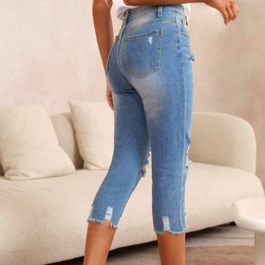 Cropped damejeans med hull og rå kant – Vasket og tøff stil